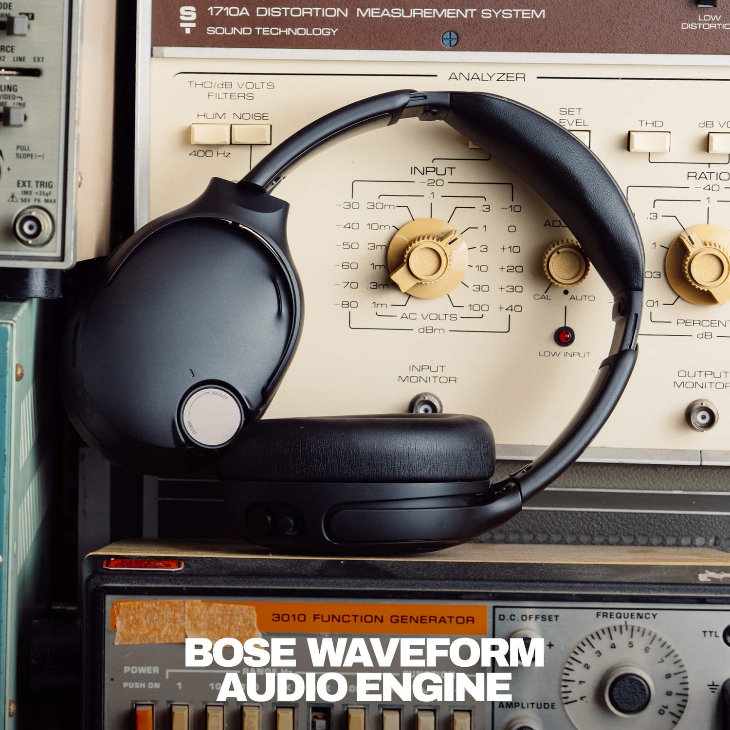 Skullcandy Headphones with Bose Waveform Audio Engine headphones on top of vintage audio equipment | True Black