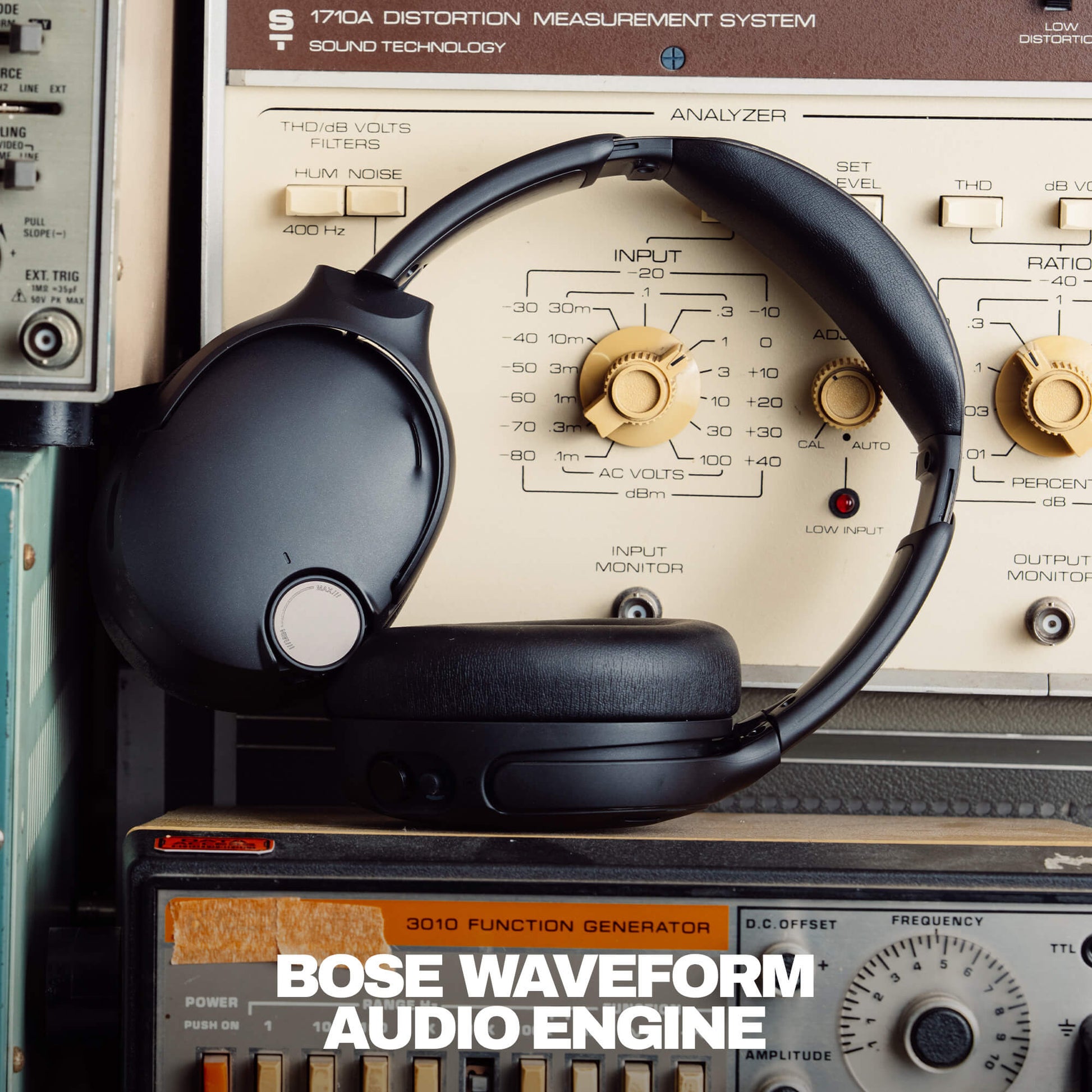 Skullcandy Headphones with Bose Waveform Audio Engine headphones on top of vintage audio equipment | True Black