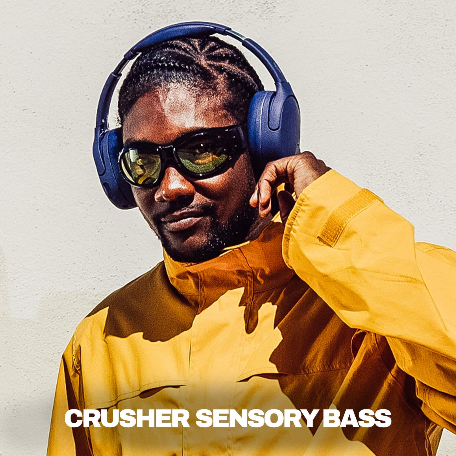 Man wearing blue Crusher 720 headphones and yellow jacket with 'Crusher Sensory Bass' text. | Future
