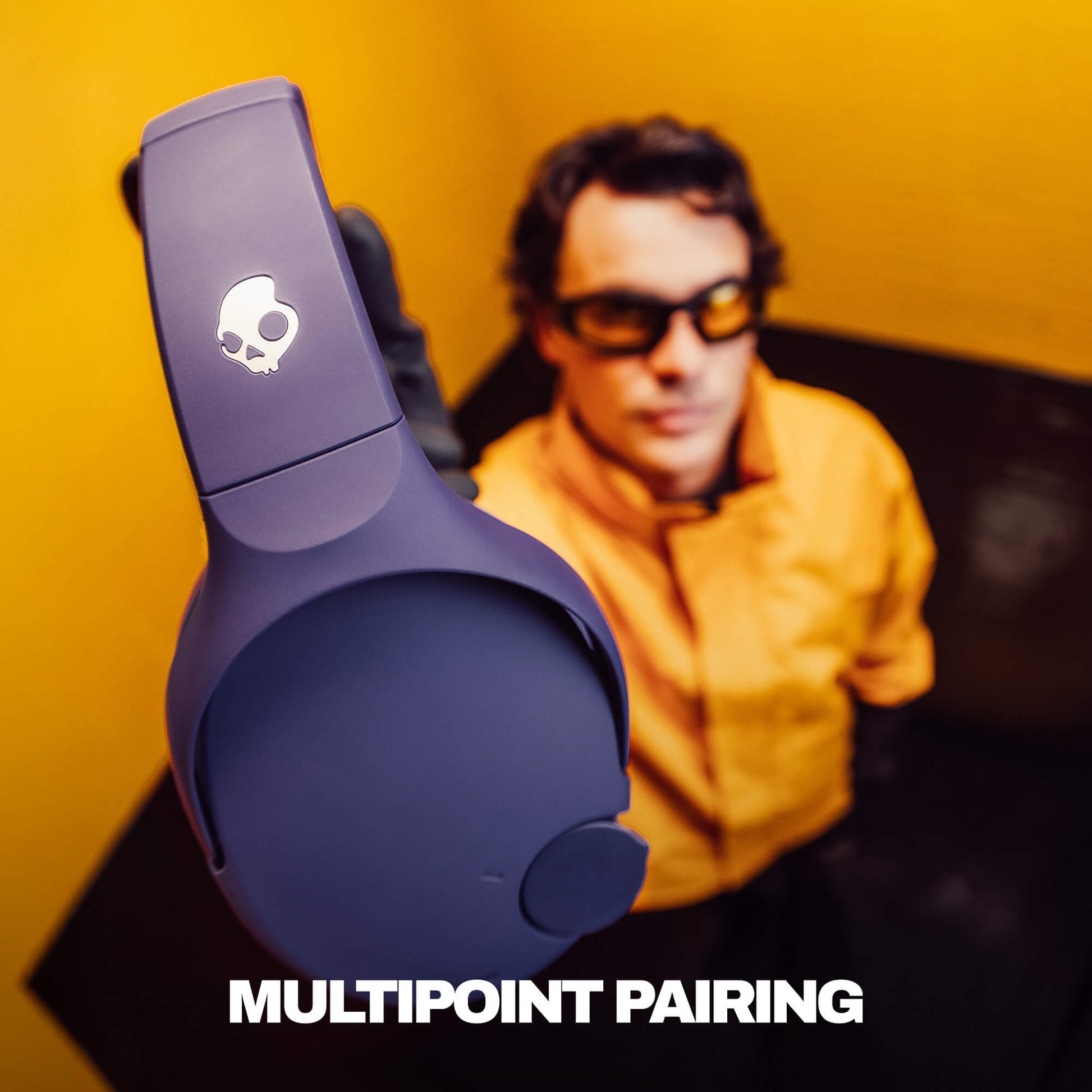 Blue Crusher 720 headphones with skull logo on a yellow background, featuring text 'MULTIPOINT PAIRING'. | Future