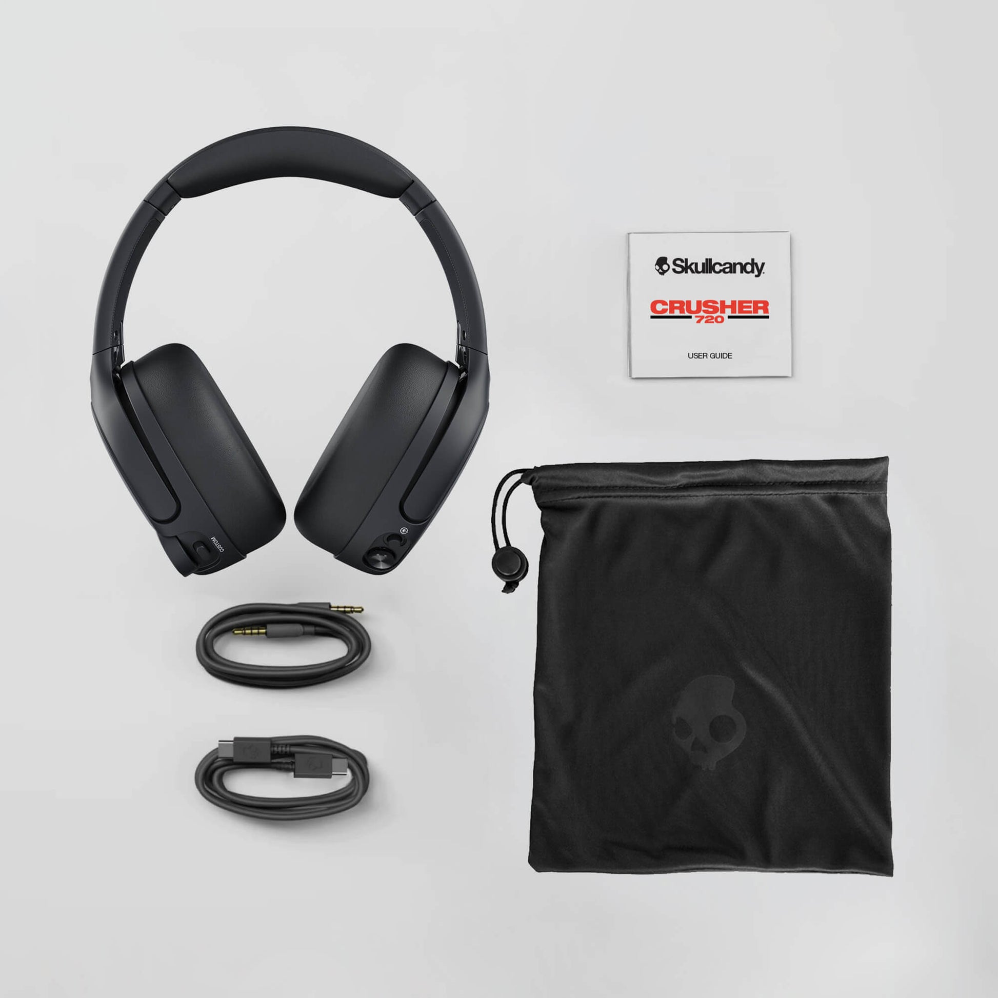 Skullcandy Crusher 720 headphones with accessories on a light gray background | Primer