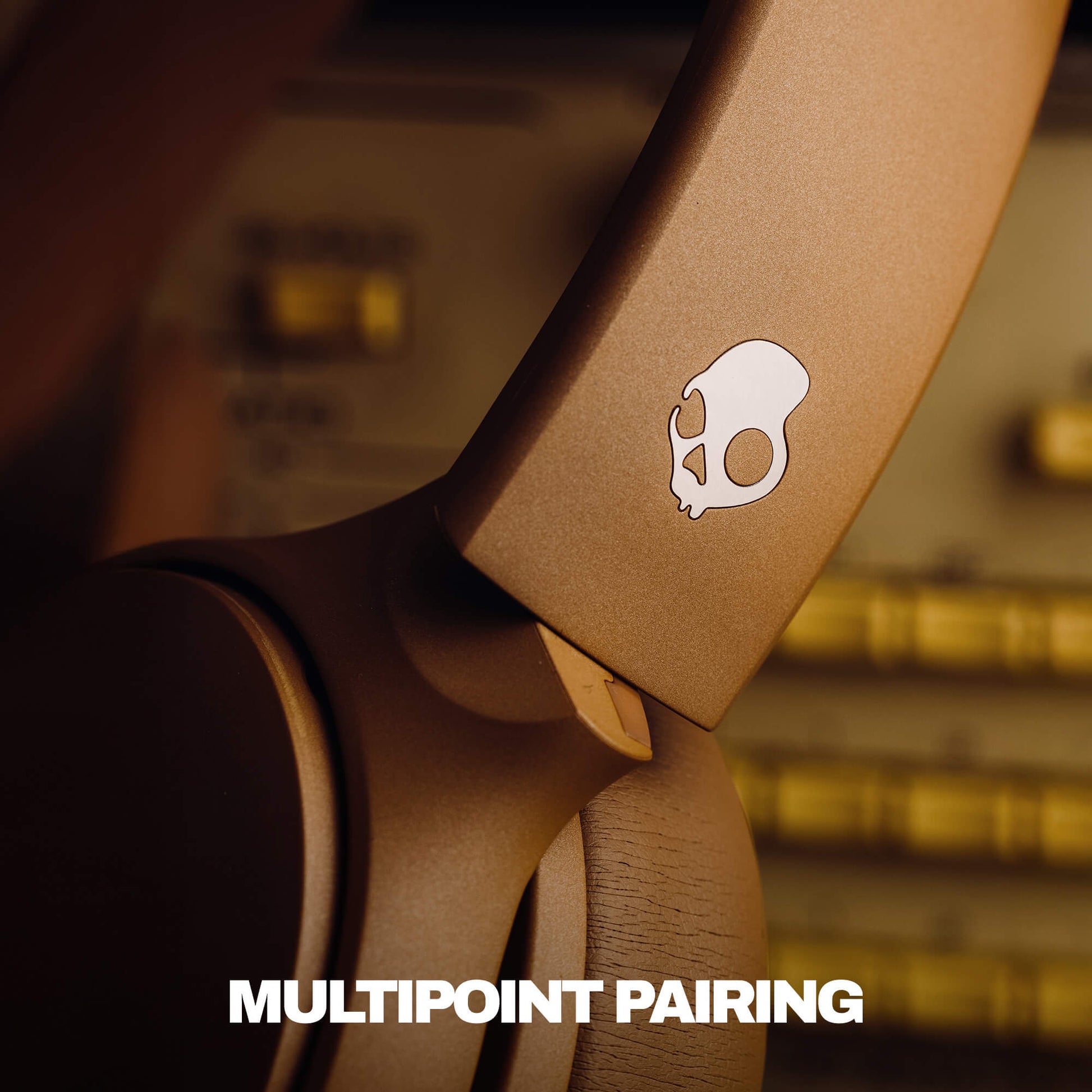 Close-up of a headphones with a logo and 'MULTIPOINT PAIRING' text. | Primer