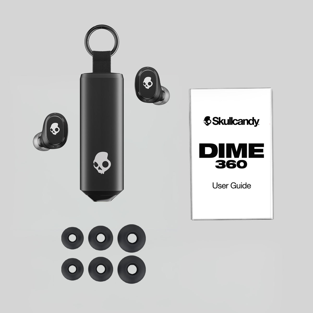 Skullcandy Dime 360 earbuds with case and user guide on a gray background | Skullcandy X Baker Skateboards