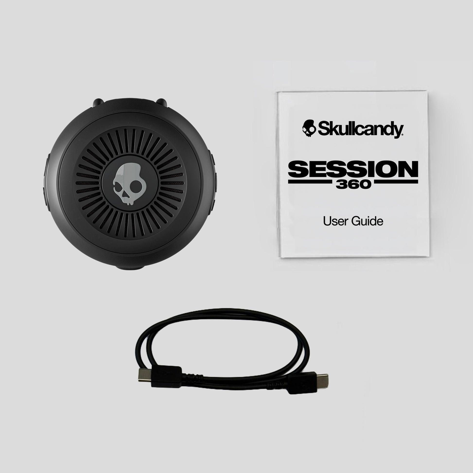 Skullcandy Session 360 headset with user guide on a light gray background | True Black