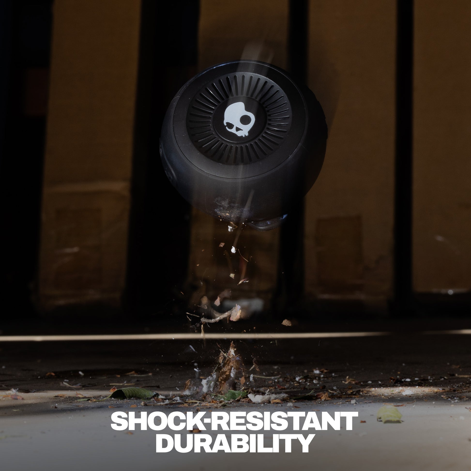 Round shockproof device with 'Shock-Resistant Durability' text on a dark background | True Black